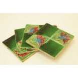 Four 19th century green glazed tiles,