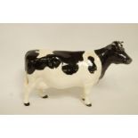 A Beswick Friesian cow, printed marks in black,