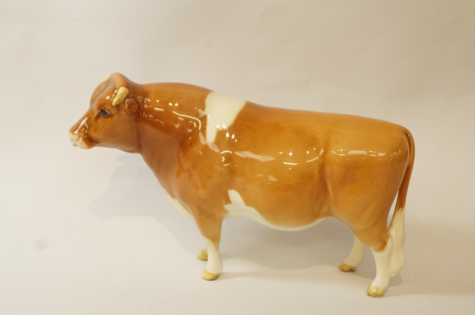 A Guernsey Beswick bull, printed factory marks in black painted "CN SABRINA'S Sir Richmond 14th",