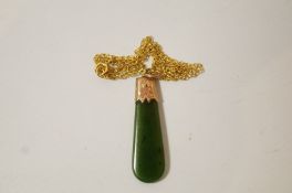 A nephrite pendant, in the form of a Maori mere,