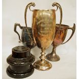 A silver two handled trophy cup, London 1920; with two other silver two handled trophy cups; 1,