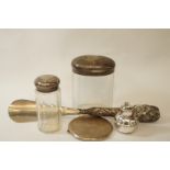 A silver compact; two glass toilet jars with silver covers;