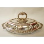 A silver plated entree dish, of oval shaped outline, with detachable handle,