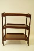 An early 20th century mahogany two section trolley