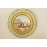 A late 19th century Minton porcelain plate, the centre painted in colours with fishing boats ashore,