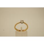 A single stone diamond 18 ct gold ring, the brilliant cut stone of approximately 0.