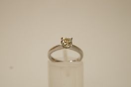 A single stone diamond platinum ring, the brilliant cut of approximately 0.