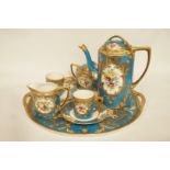 An early 20th century Noritake coffee set with gilt overlay decoration on a blue ground,