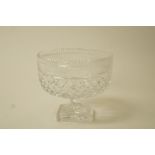 A cut glass bowl on flared pedestal and square star cut base,