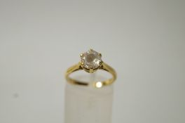 An 18ct gold single stone ring, 3.