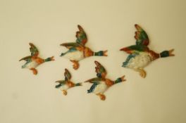 A set of four Beswick mallard plaques, printed marks and pattern numbers 596/1, 596/2, 596/3,