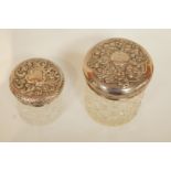 A cut glass toilet jar with silver pull off cover,