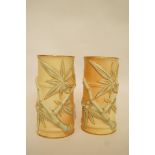 A pair of Royal Worcester blush ivory vases moulded with bamboo and picked out in gilt,