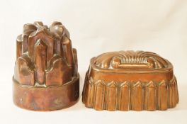Two Victorian brass jelly moulds, one of circular form marked R,