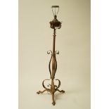 An Arts and Crafts style brass and copper oil lamp, converted to a standard lamp,