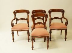 A set of twelve Victorian style mahogany balloon back dining chairs,