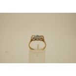 An aquamarine and diamond three stone 9 ct gold ring,