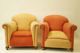 A pair of early 20th century armchairs with bun feet