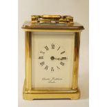 A brass framed carriage clock by Charles Frodsham London, striking on a bell, 18.