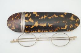 A 19th century tortoiseshell and silver mounted spectacle case,