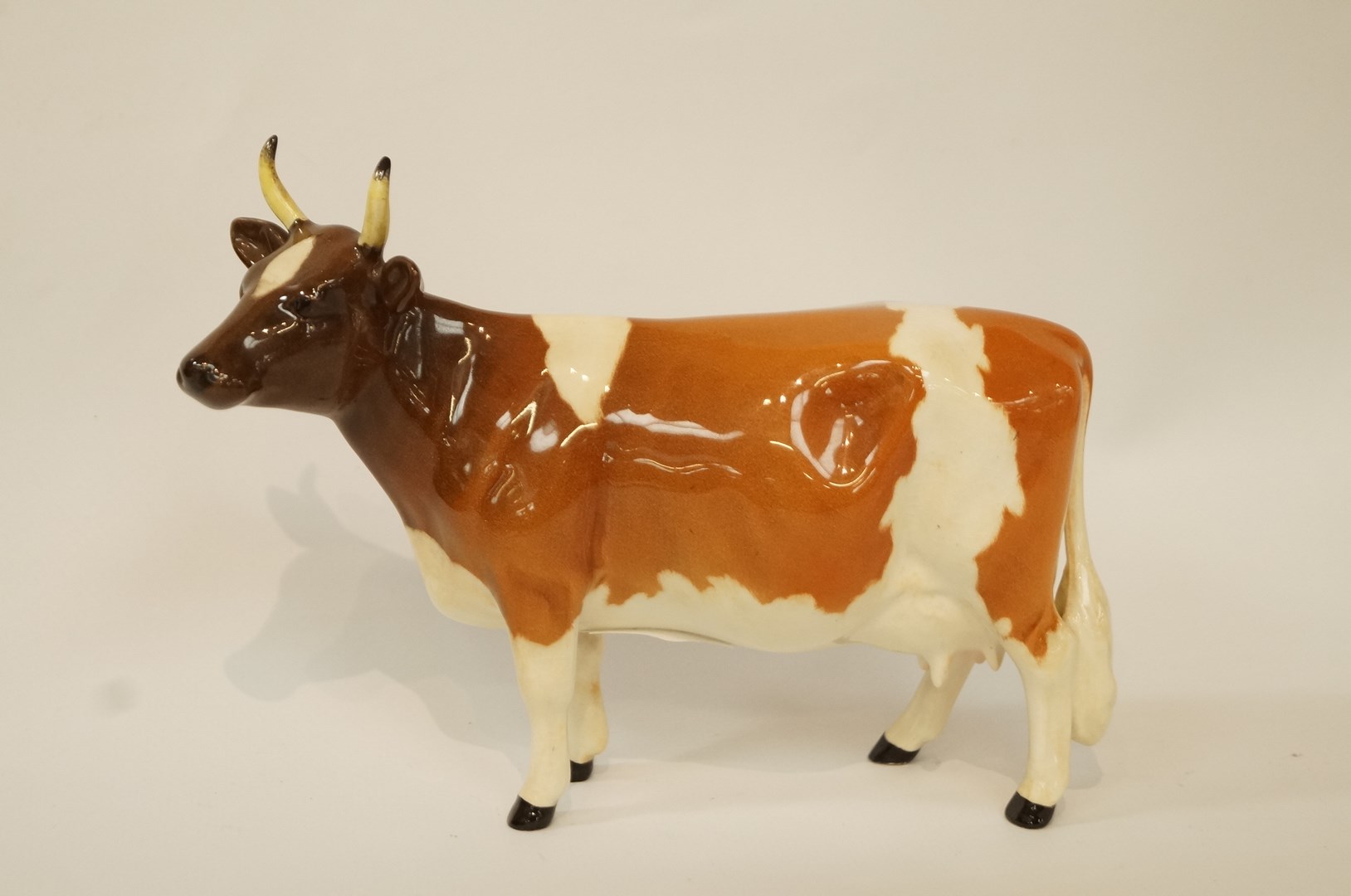 A Beswick Ayrshire cow, printed factory marks in black, 12cm  high, 17.