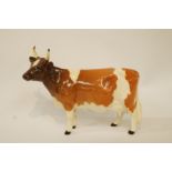 A Beswick Ayrshire cow, printed factory marks in black, 12cm  high, 17.