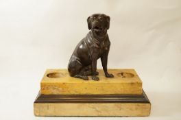 A Regency Sienna marble desk stand with bronze finial of a dog seated,