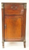 A mahogany side cabinet with one frieze drawer above a panelled door,