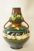 A Foley Intarsio two handled vase, designed by Frederick Rhead,