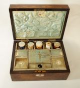 A Victorian walnut sewing box with mother of pearl inlay and silk interior,