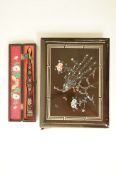A lacquer photograph album, with painted mother of pearl bird on a branch,