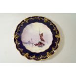 A Royal Crown Derby plate painted with a sea scene, signed W E Dean, printed marks,