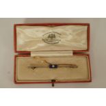 An Art Deco diamond and lapis lazuli bar brooch,