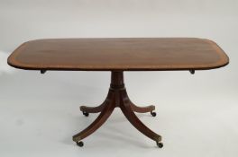 A George IV mahogany and satinwood crossbanded breakfast table with tilt top,