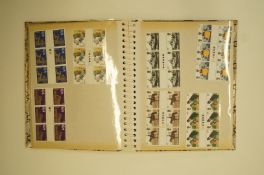 A stamp album with GPO 2'6, 3, 9, 5' stamp books unused, 144 Penny Reds, two Penny Blacks,