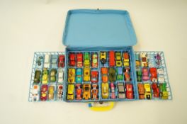 A Matchbox carry case and various toy cars