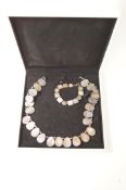 A mother of pearl necklace and bracelet,
