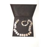 A mother of pearl necklace and bracelet,