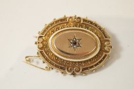 A Victorian oval gold brooch,