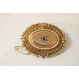 A Victorian oval gold brooch,
