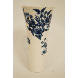 An English porcelain trumpet shaped vase, transfer printed in underglaze blue with flower sprays,