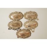 A matched set of five modern silver wine labels;