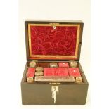 A Victorian rosewood dressing case with mother of pearl inset plaque,