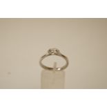 A single stone diamond platinum ring, the brilliant cut of approximately 0.