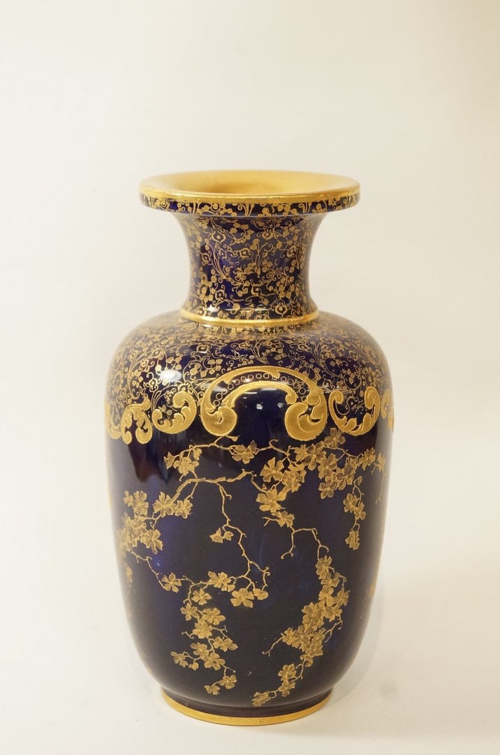 A Doulton vase printed in gilt with flowering branches, factory marks printed and impressed, 18.