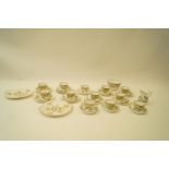 A Minton porcelain tea service, printed and painted with sunflowers, comprising of twelve cups,