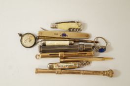A 9ct gold propelling pencil; a Victorian propelling pencil; a silver example;
