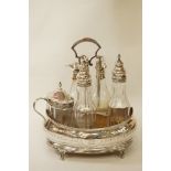 A George III silver cruet stand with bottles; makers mark worn, London 1808,