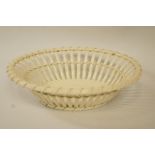 A Wedgwood creamware oval basket, with moulded base, impressed marks,
