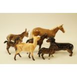 A collection of Beswick figures a Daschund, a foal, a fawn, a Shetland foal, a donkey,